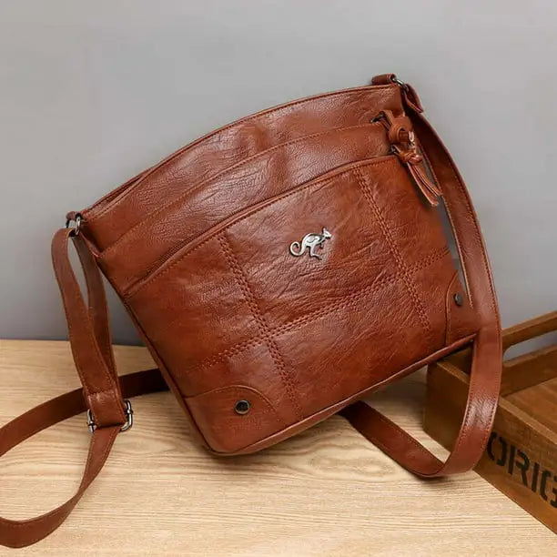 Silvia | Bolso Cruzado con Emblema